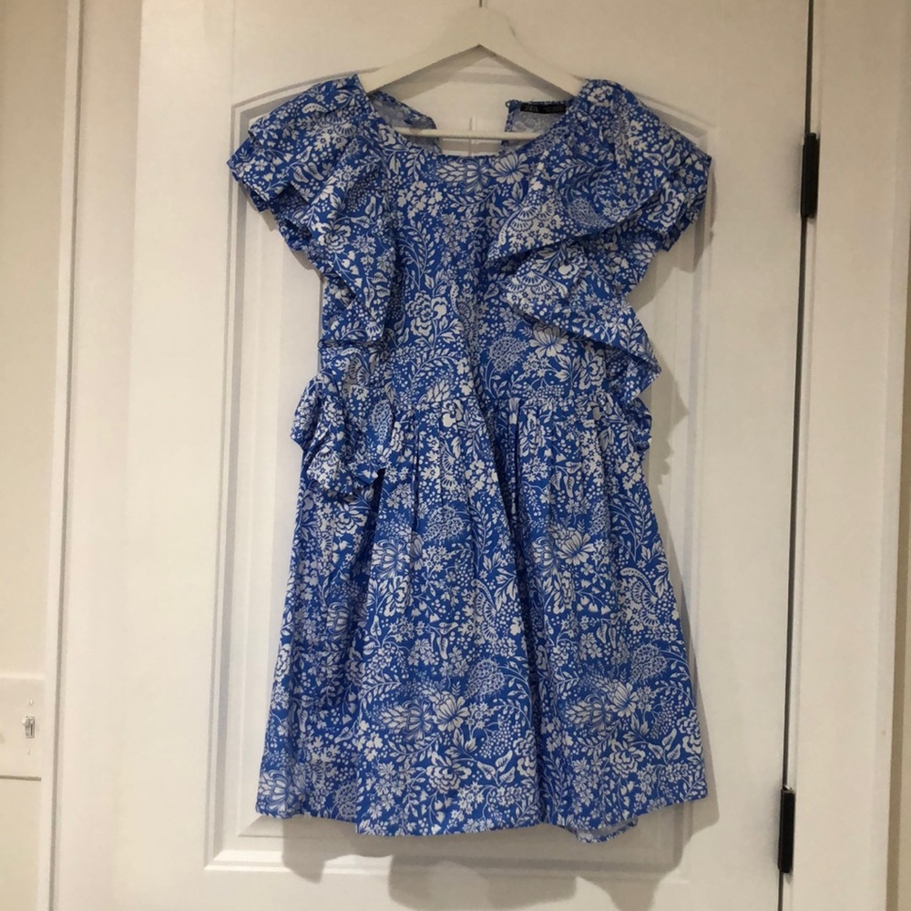 beautiful blue and white floral dress with ruffle sleeves and a key hole back